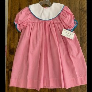 Pink gingham bishop dress.